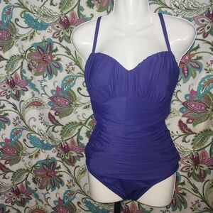 Miraclesuit ruched one piece swimsuit with adjustable straps and thin padding.